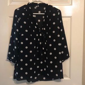 Black top with white polka dots.